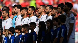 The players of Iran line up for the national anthem prior to the FIFA World Cup Qatar 2022 Group B match between Wales.